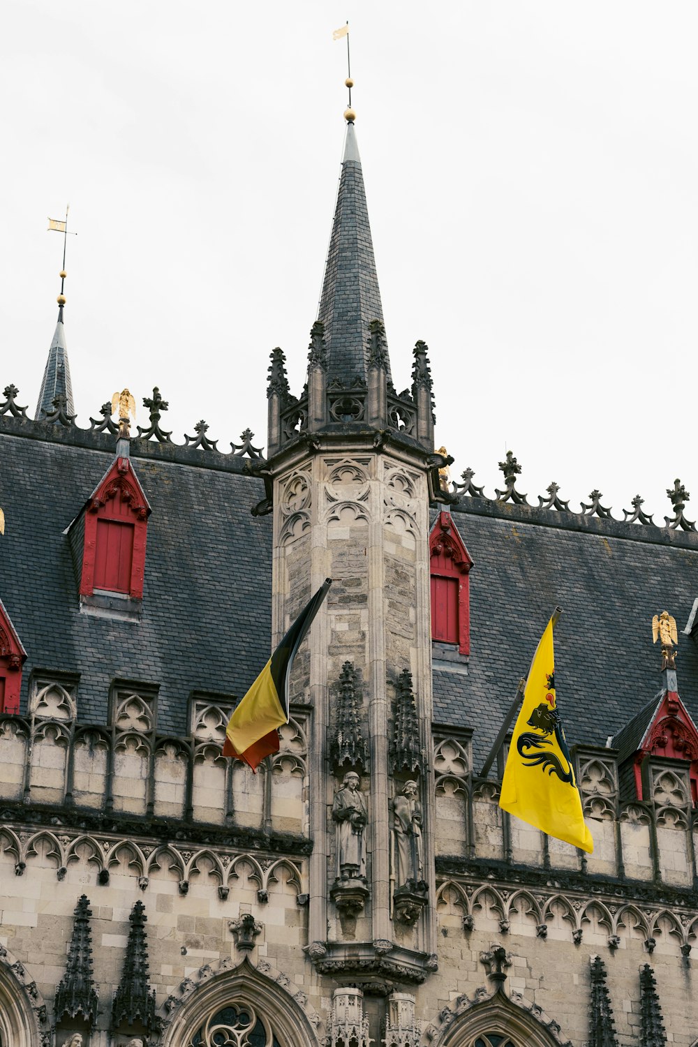 a building with a tower and flags