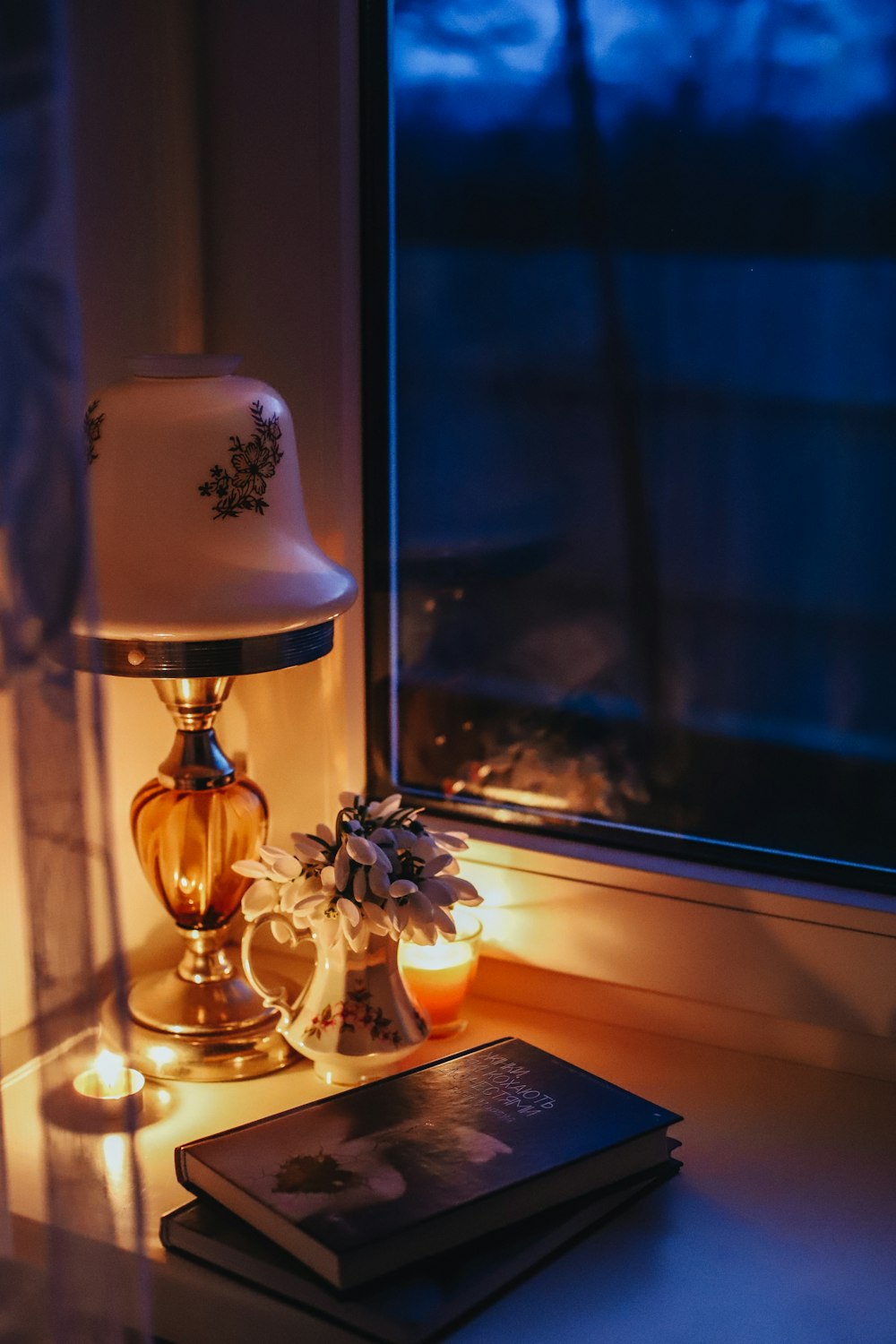 a lamp and a book on a table