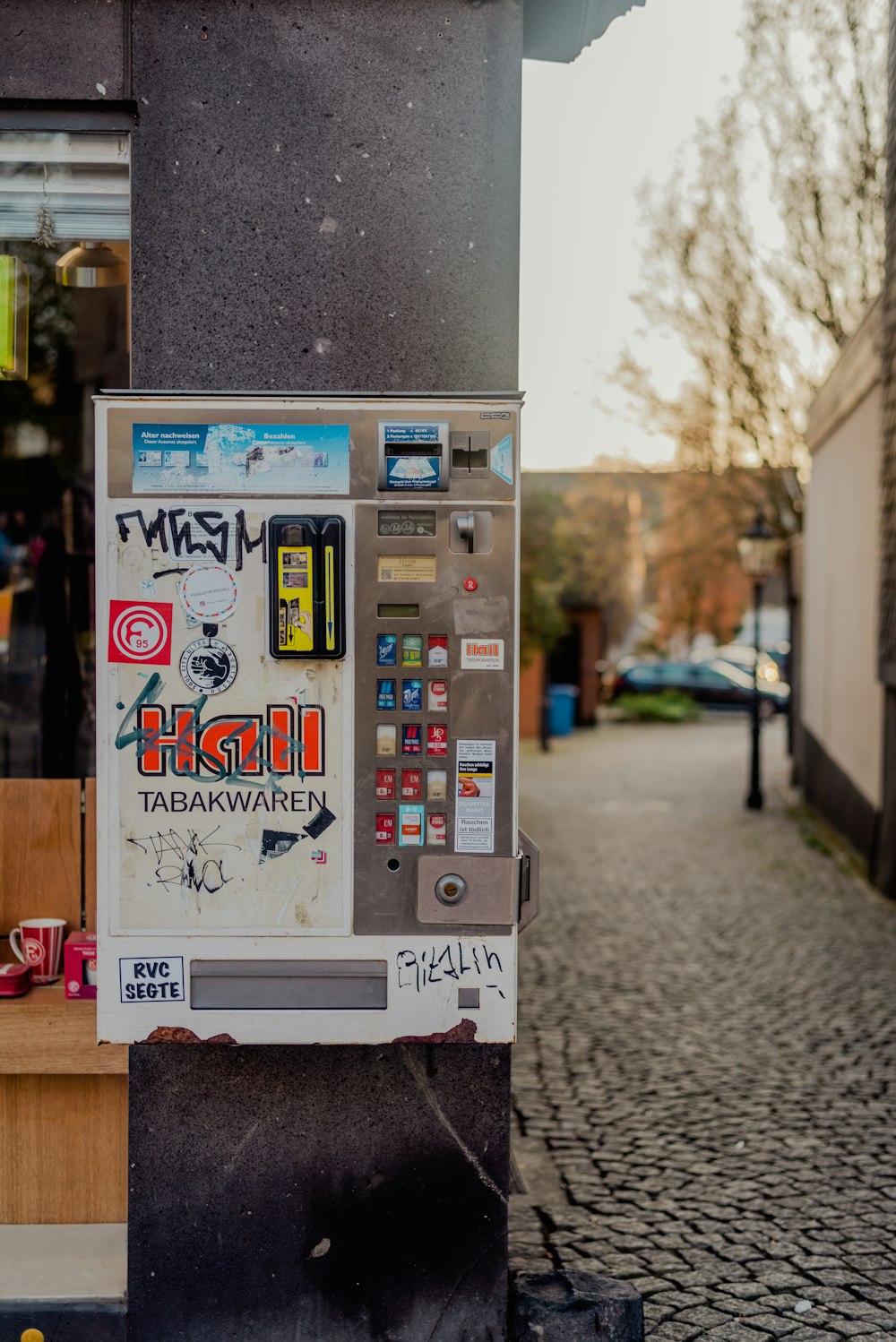 a pay phone on a sidewalk