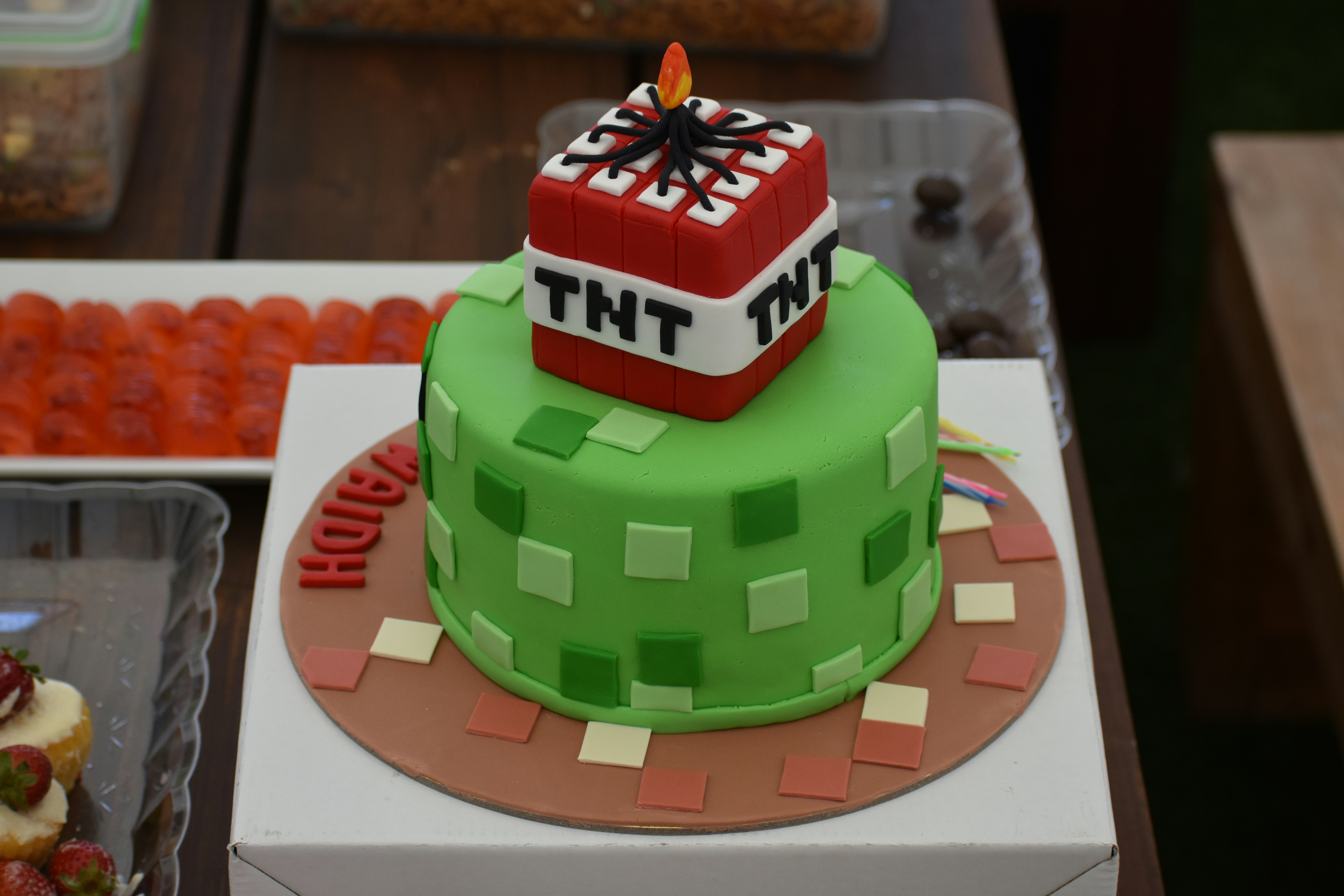 Minecraft themed party with green and brown pixel decorations and creeper details