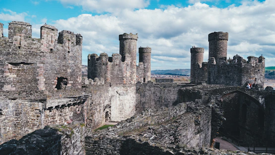 a stone castle with a bridge