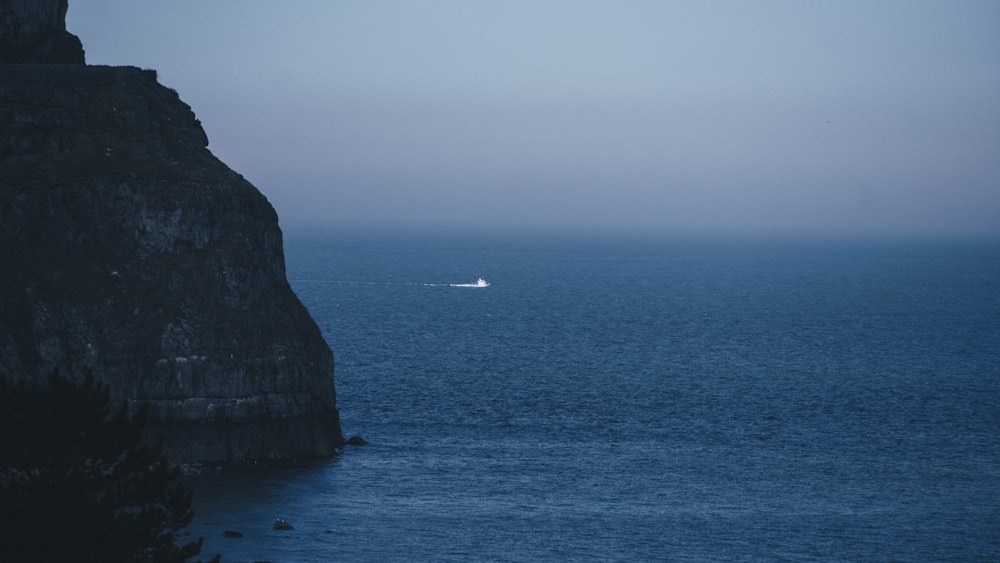 a cliff next to the ocean