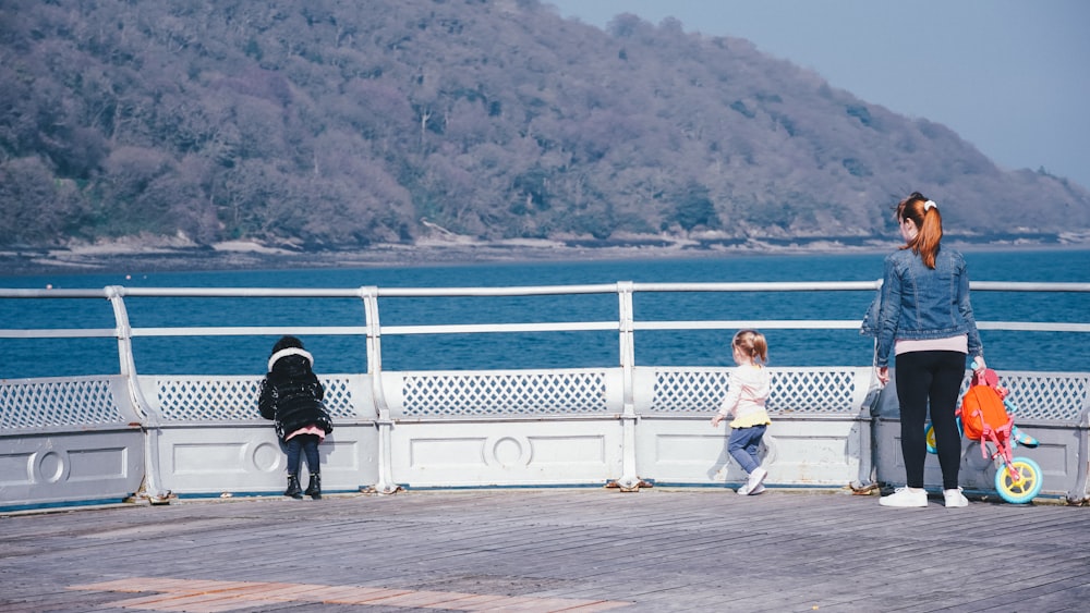 a person and a child on a pier