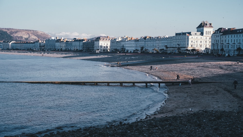 a beach with buildings in the background