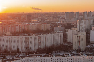 Modern cityscape with high-rise residential buildings at sunset