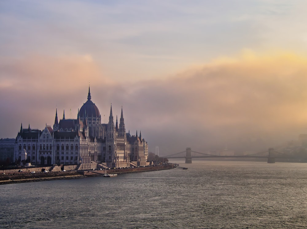 a castle on a hill by the water