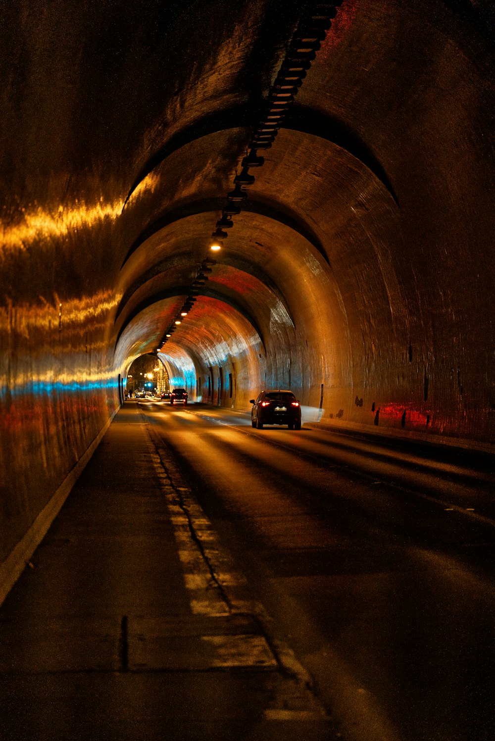 a car driving through a tunnel