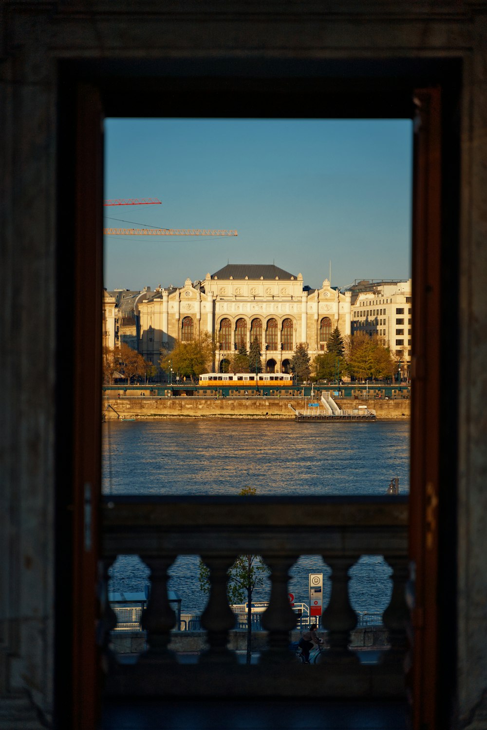 a window with a view of a city and a river