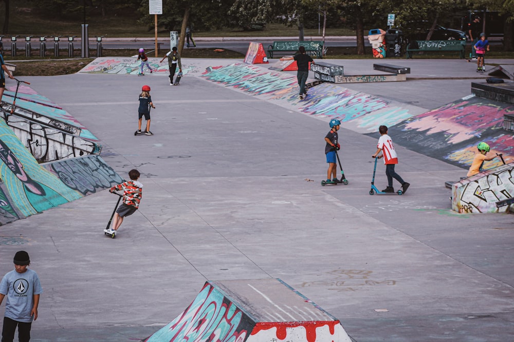 a group of people skating on a ramp