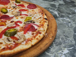a pizza with tomatoes and cheese