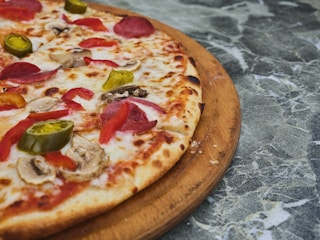 a pizza with tomatoes and cheese