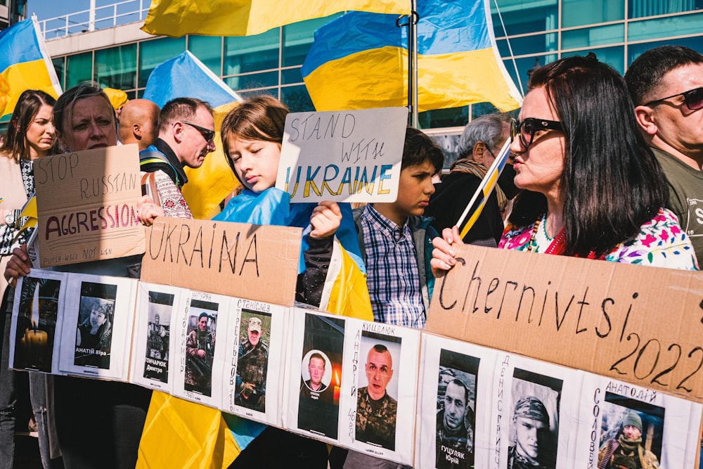 a group of people holding signs