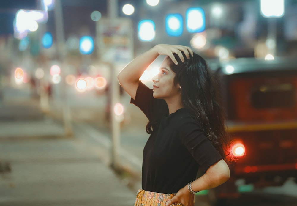 a woman with her hand on her head