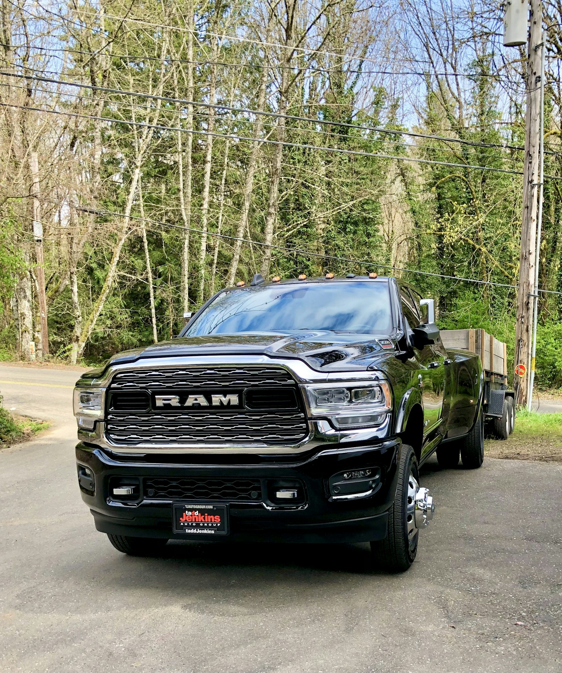 a black truck parked on a road