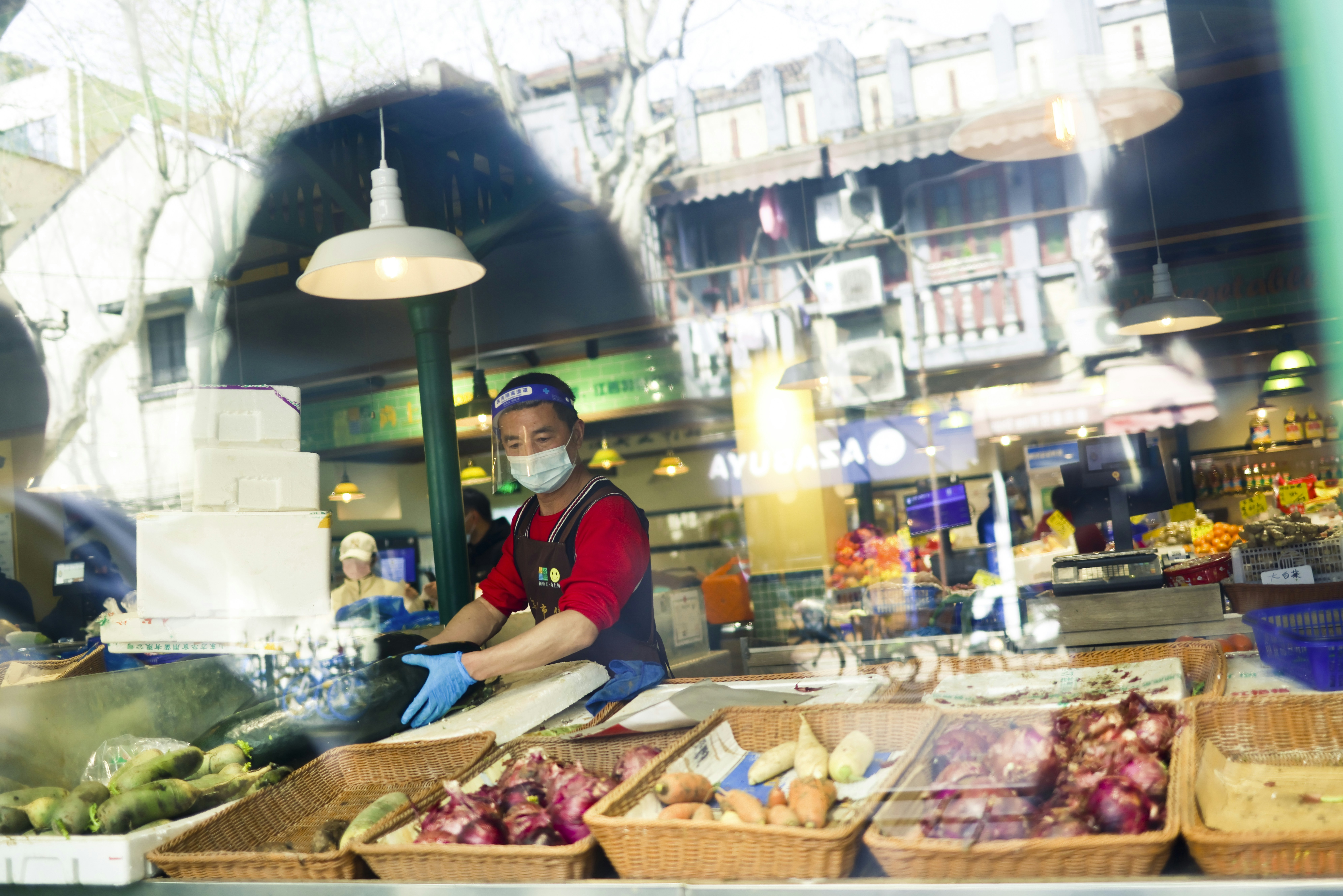 a person in a mask in a market