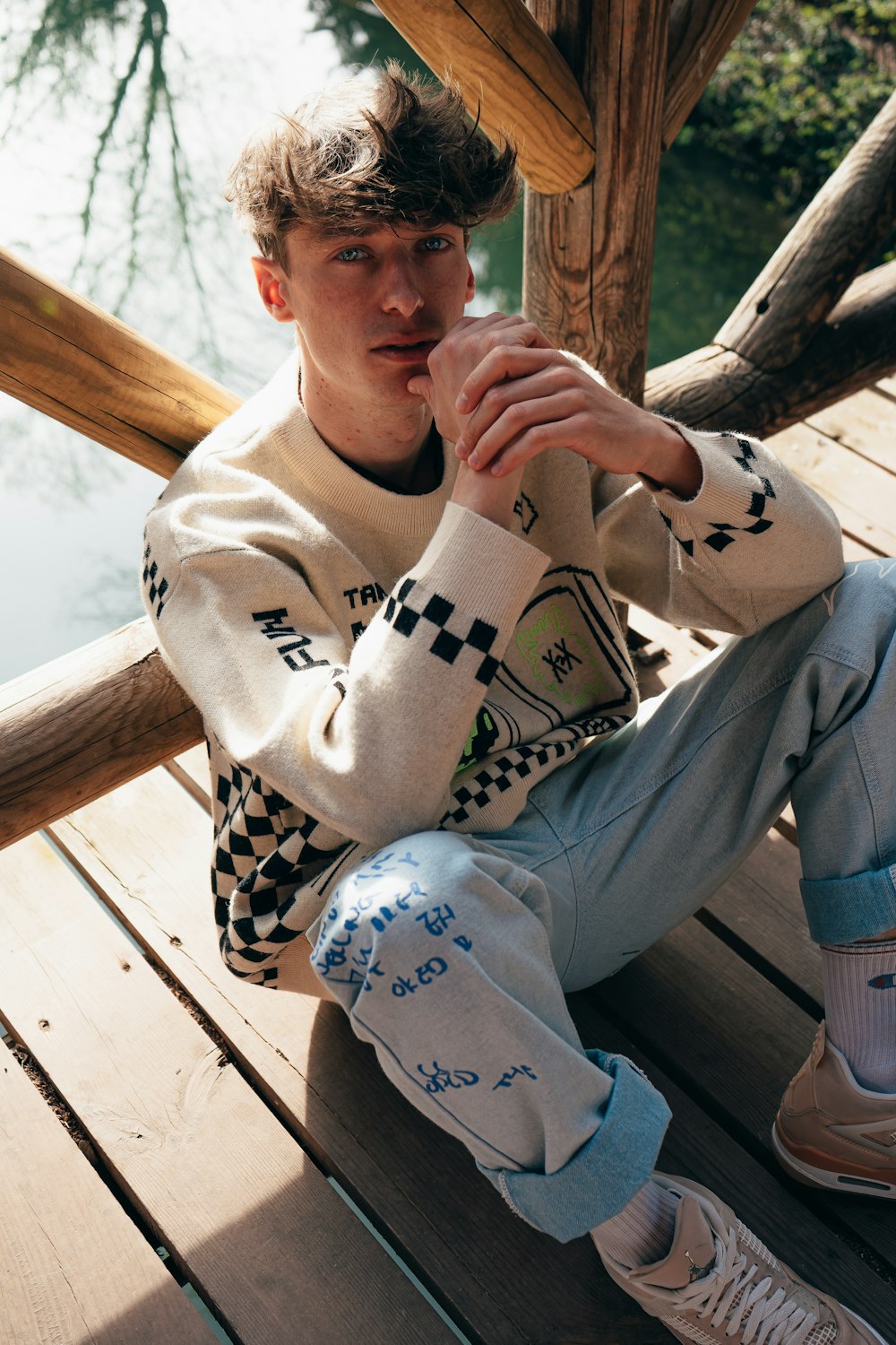 a person sitting on a wooden bench