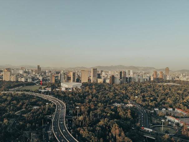a city with a freeway and trees