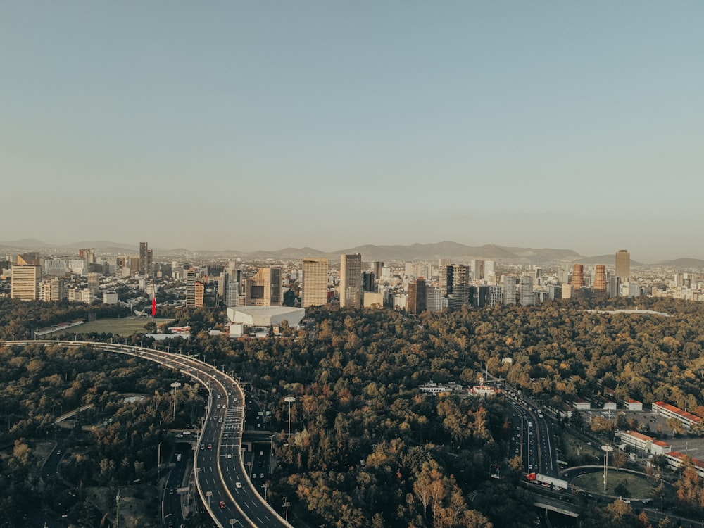 a city with a freeway and trees