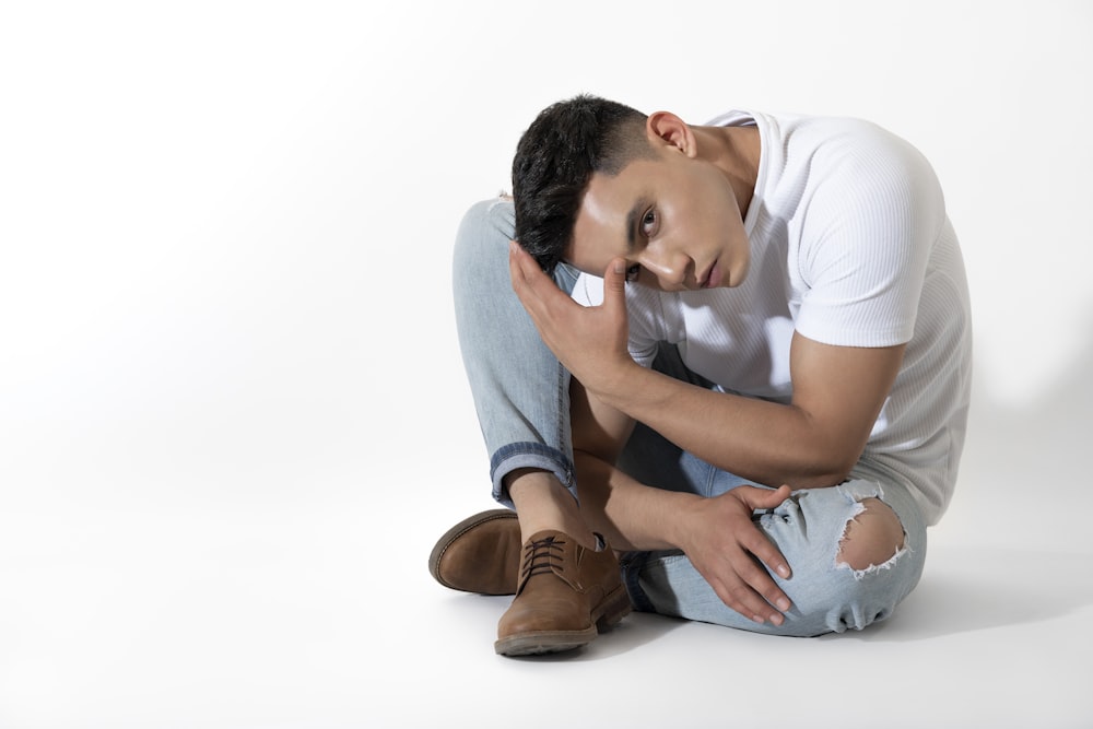 a man sitting on the floor