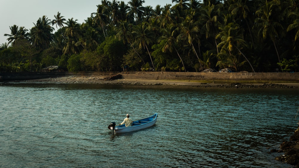 a man in a boat on the water