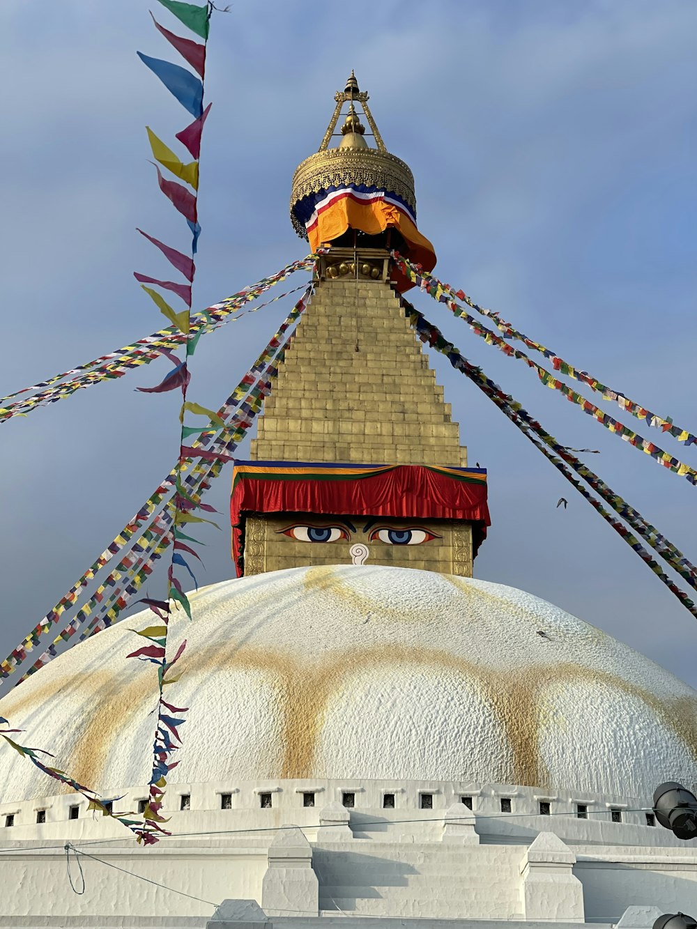 Boudhanath with a tower and flags