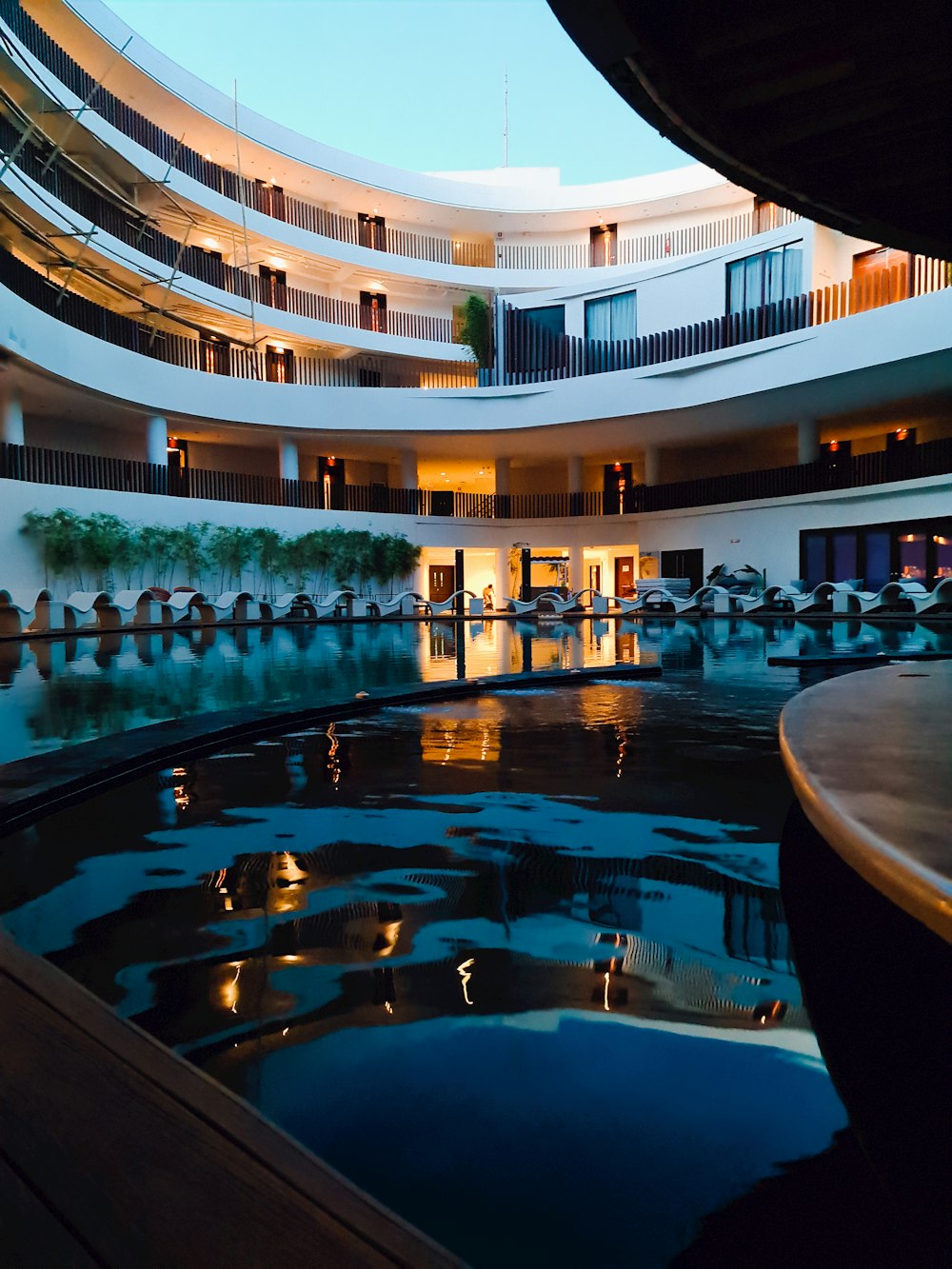 a pool in a courtyard of a building