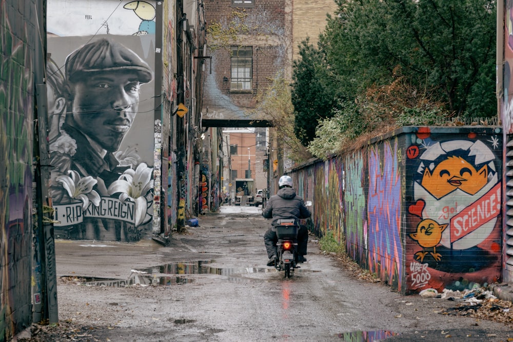 a man riding a motorcycle down a street