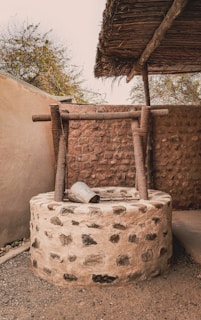 a stone structure with a roof