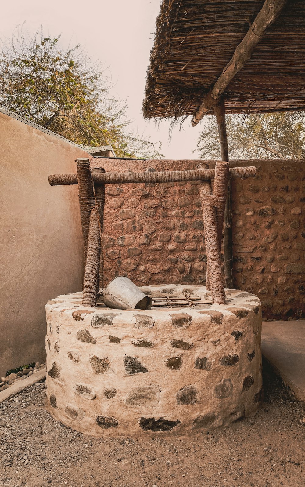 a stone structure with a roof