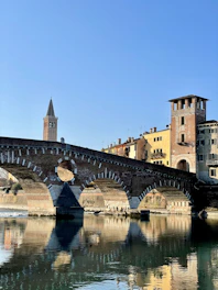 a bridge over a river with buildings on either side of it