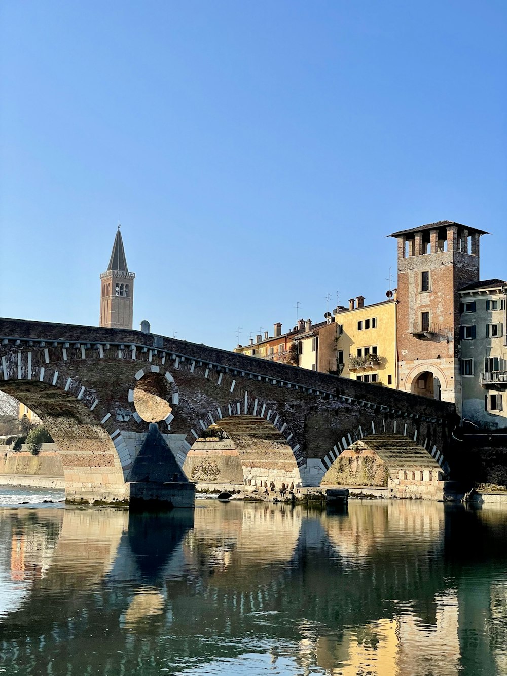 a bridge over a river with buildings on either side of it