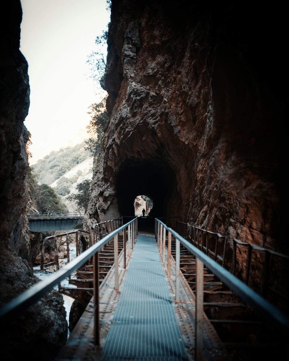 a staircase going through a cave