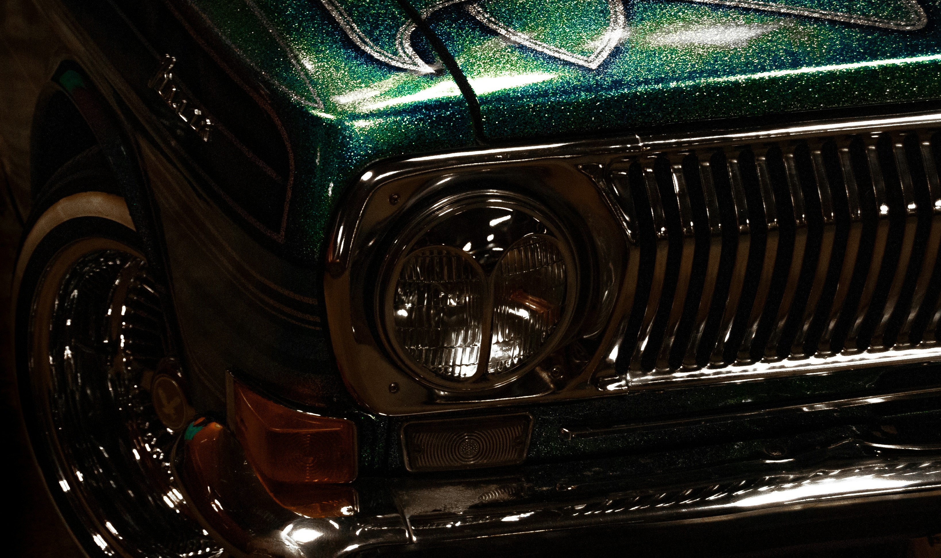 a close up of a car's headlight