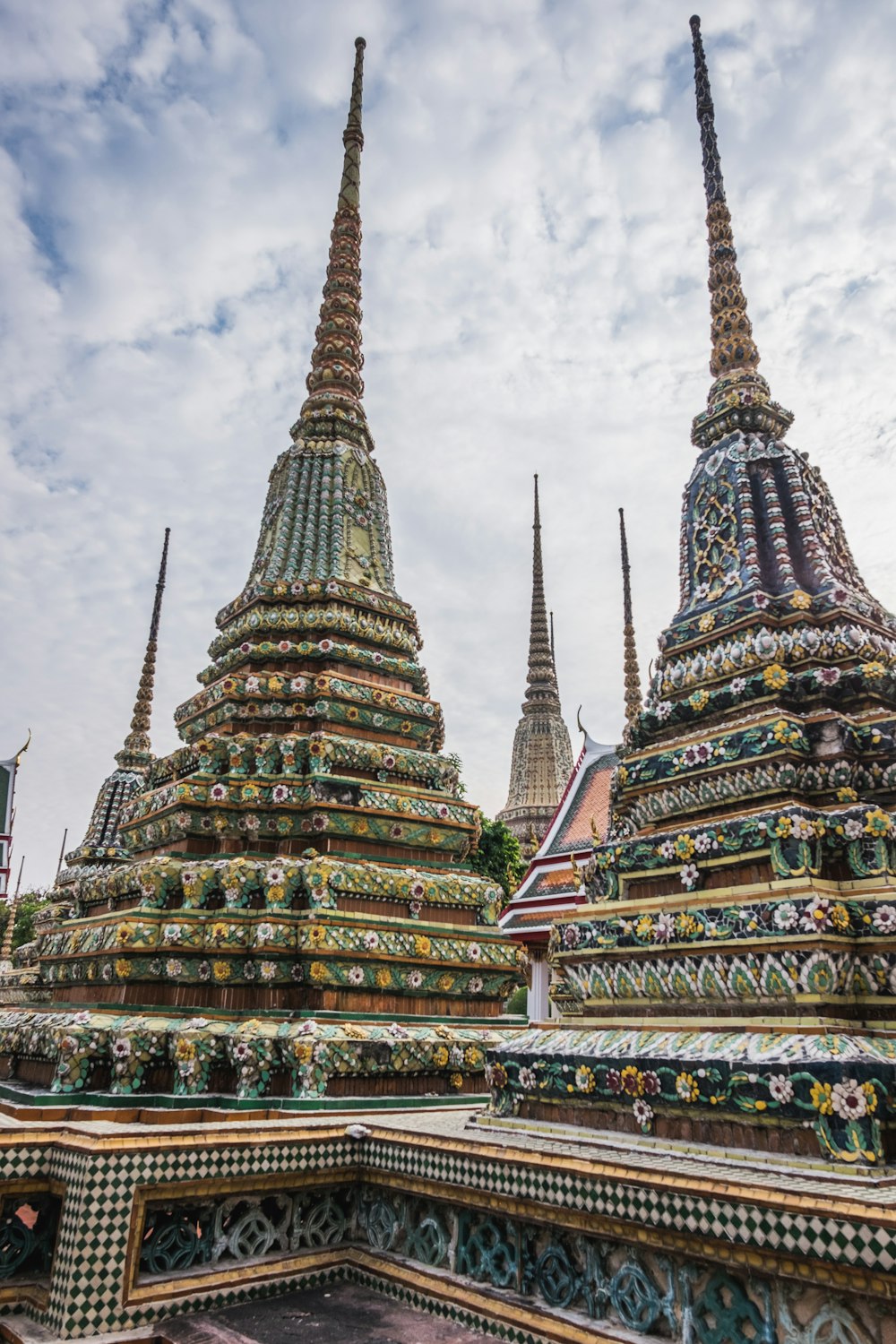 a large building with Wat Pho in the background
