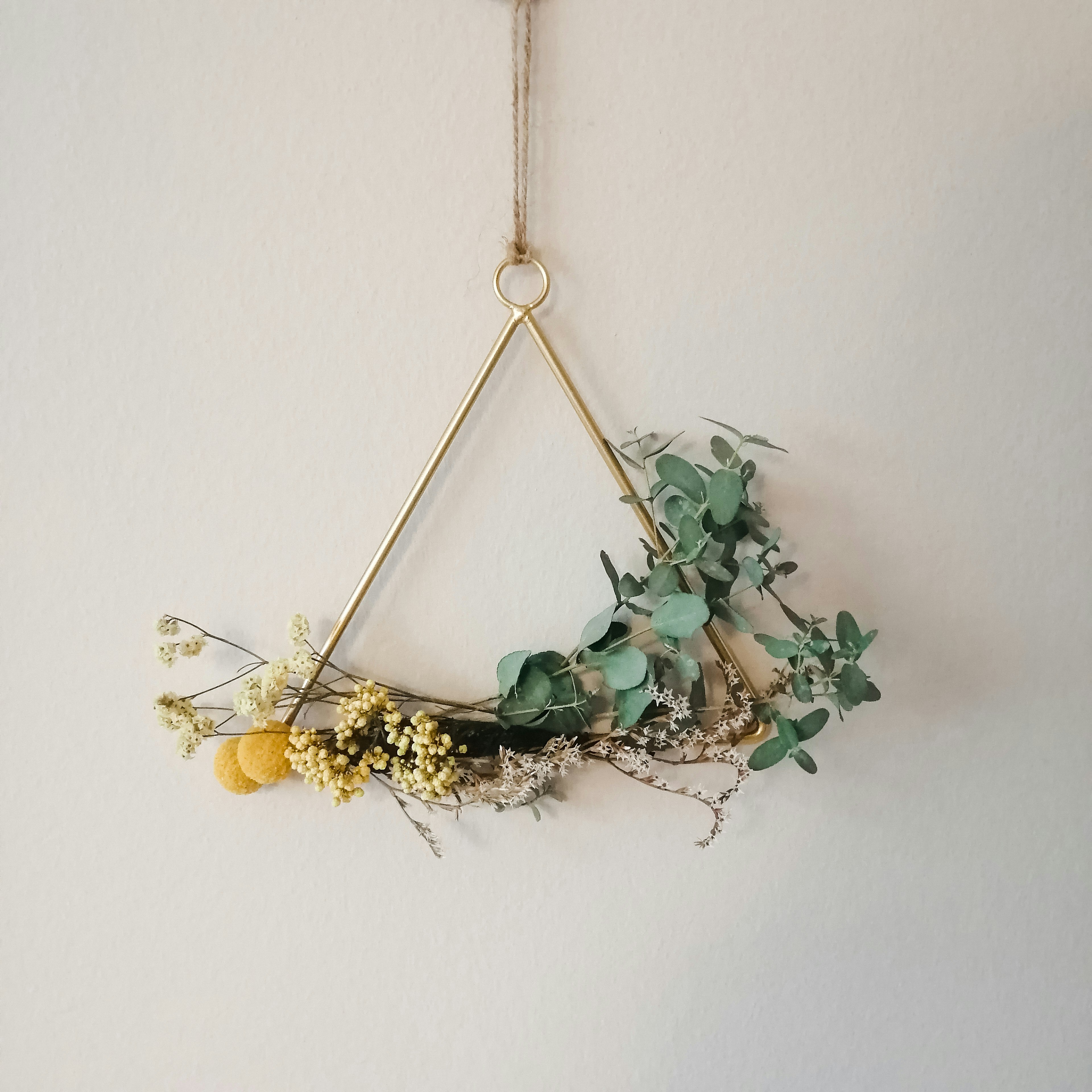 a gold and green pendant