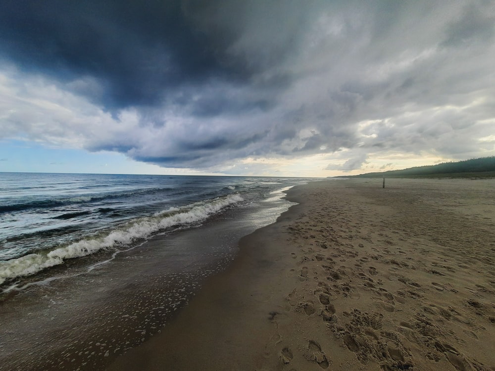 a beach with waves crashing on it