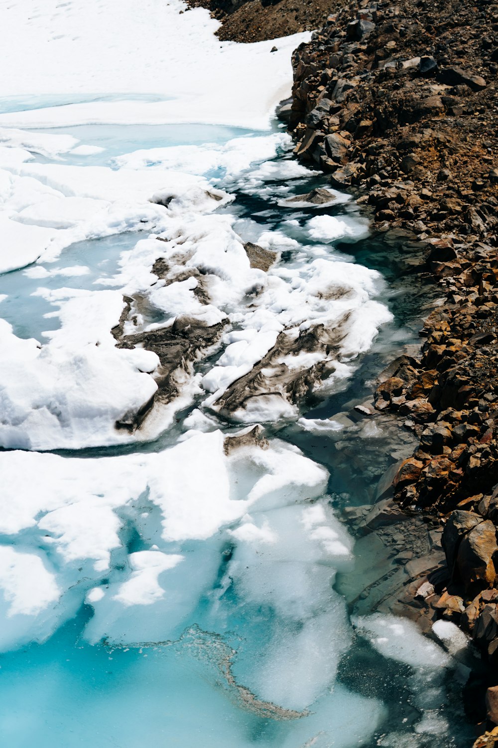 a river with ice and snow