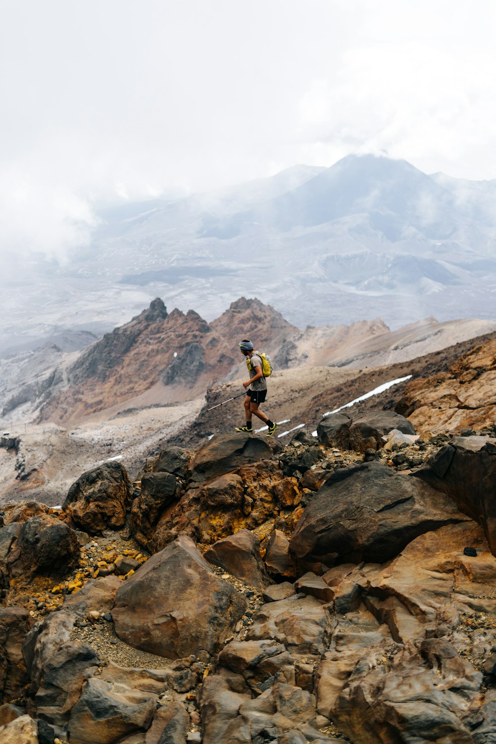 a man hiking on a rocky mountain