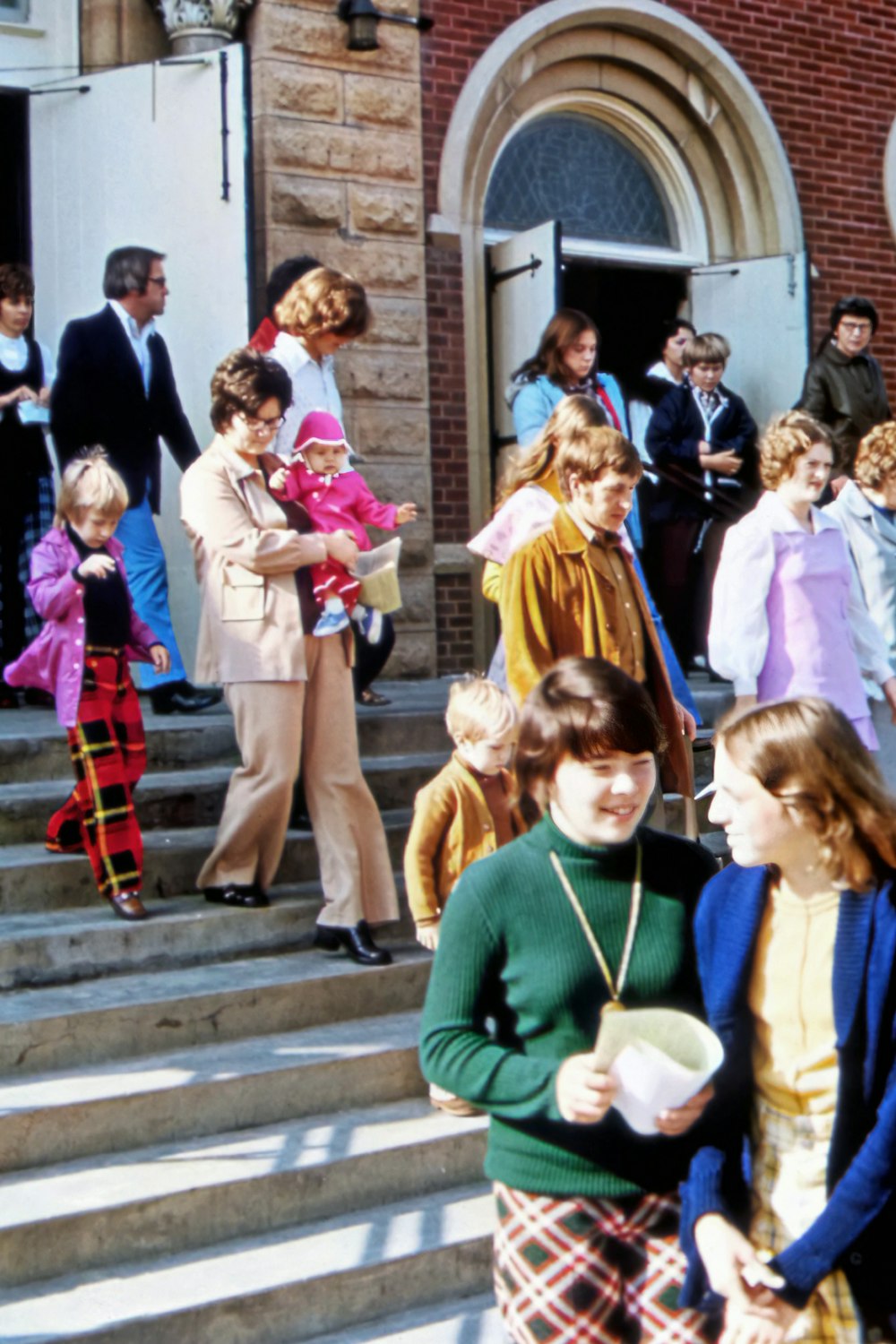 a group of people standing on stairs