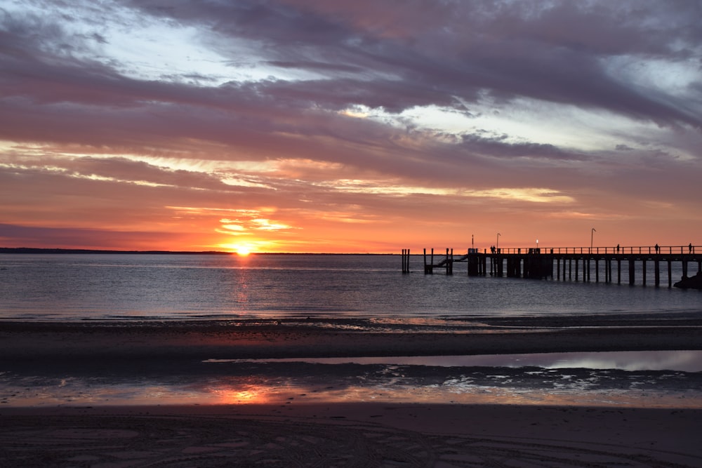 a sunset over a beach