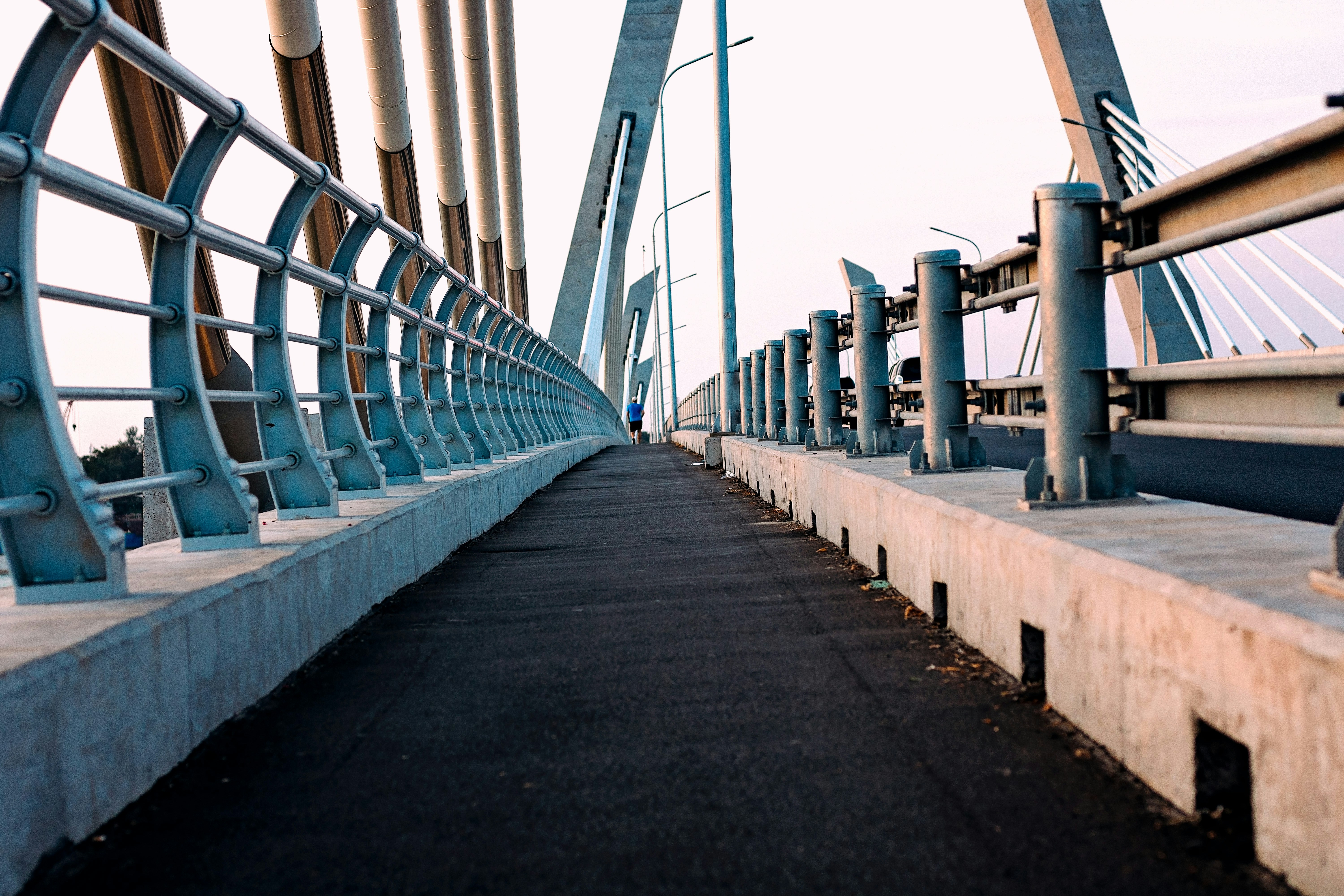 a bridge with metal railings, 