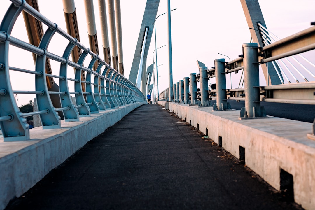 a bridge with metal railings,