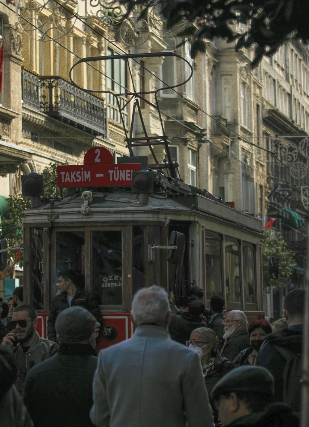 a crowd of people walking down a street