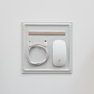 a white rectangular object with a silver circle on it