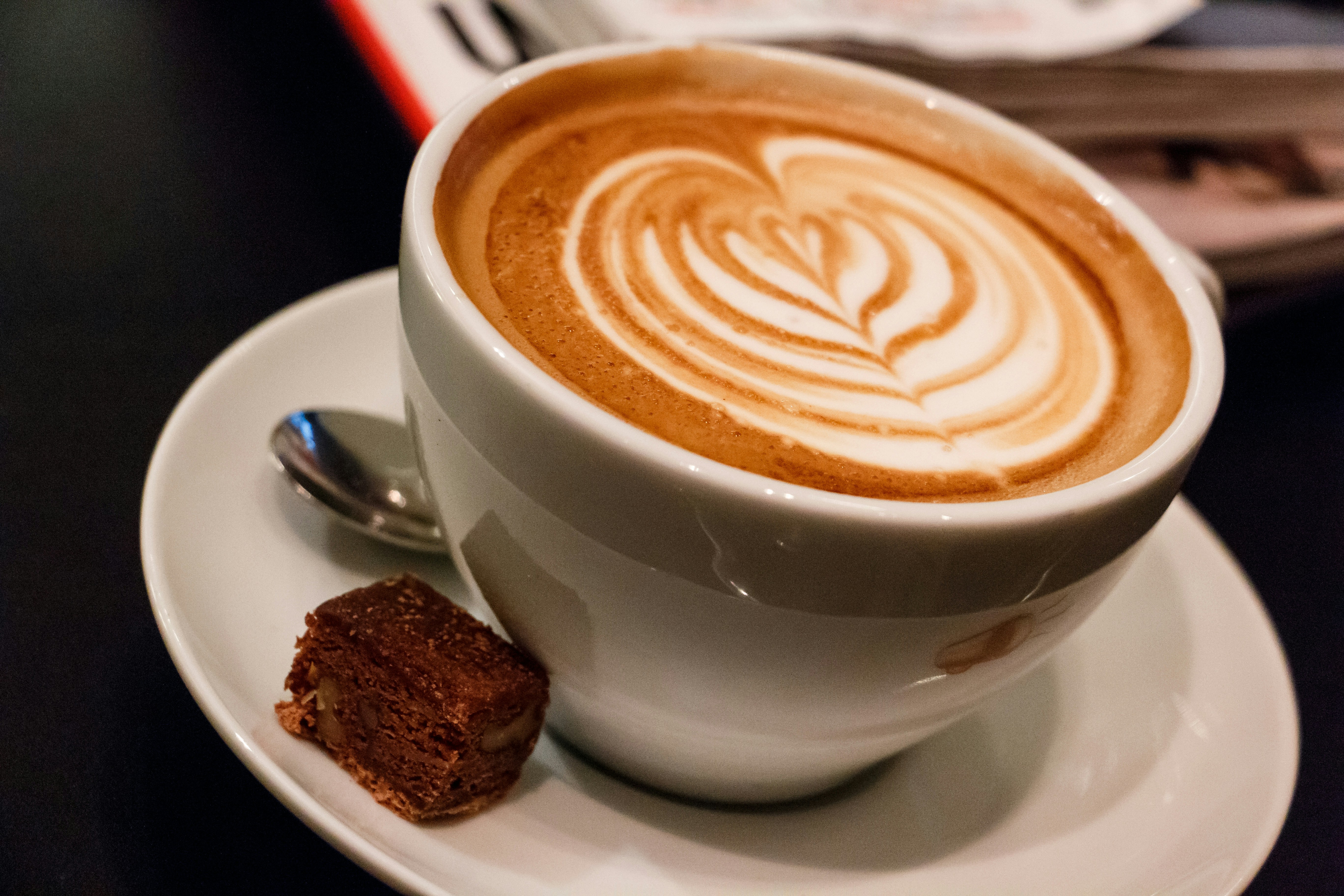a cup of coffee with a foamy beverage in it