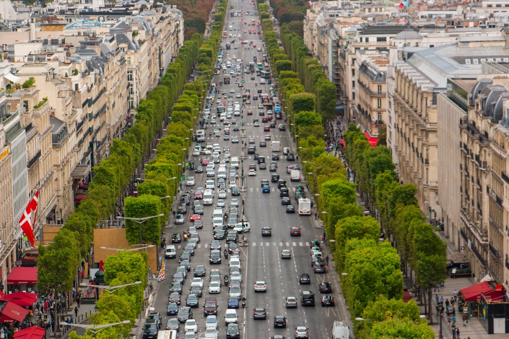 a busy street with cars and buildings