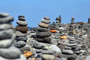 Stacks of smooth sandstone blocks arranged neatly in an outdoor yard.