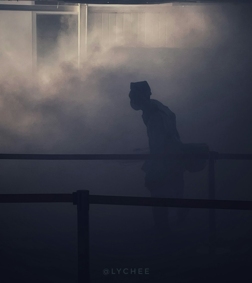 a person sitting on a railing