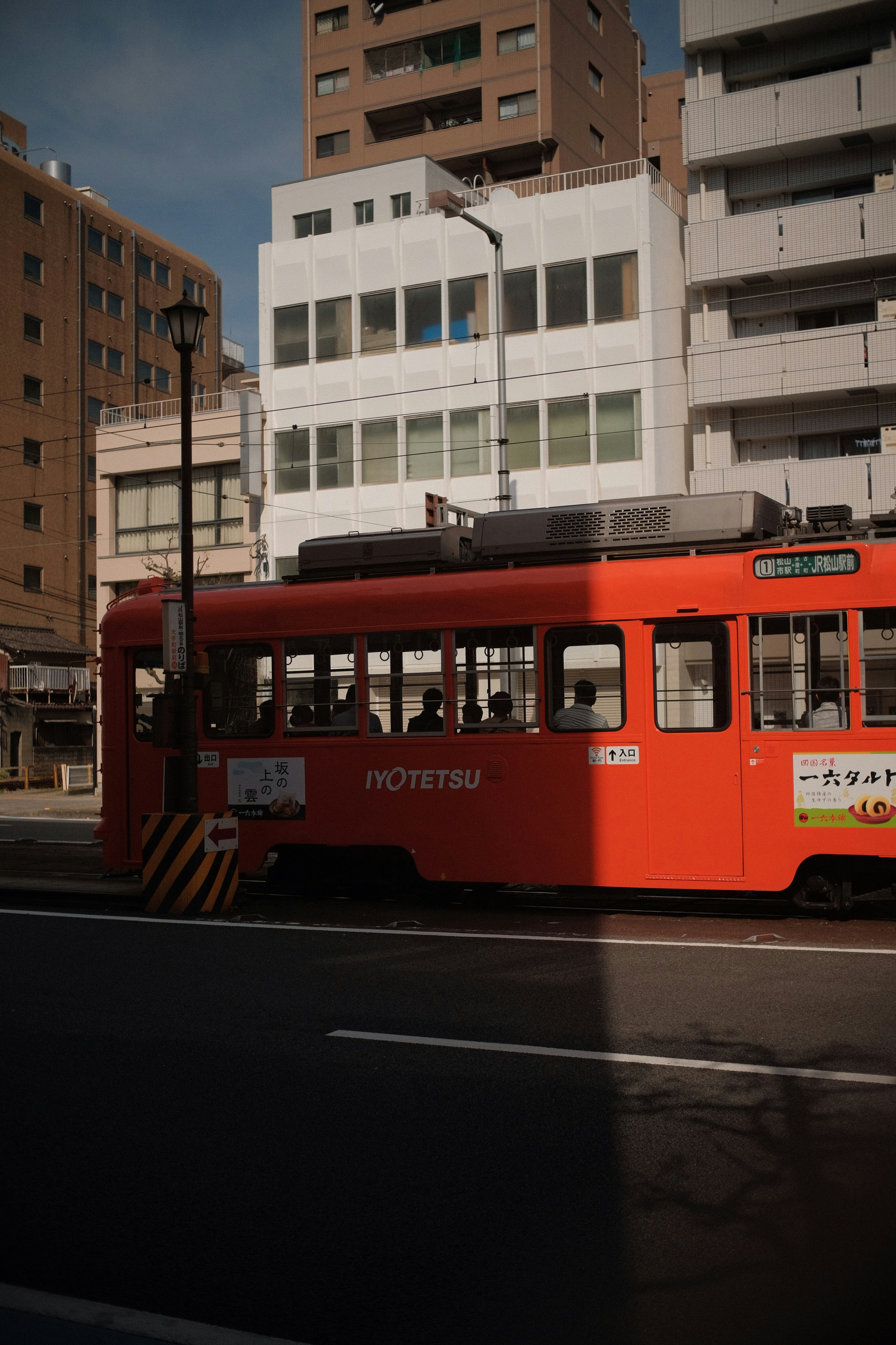a red trolley on a street
