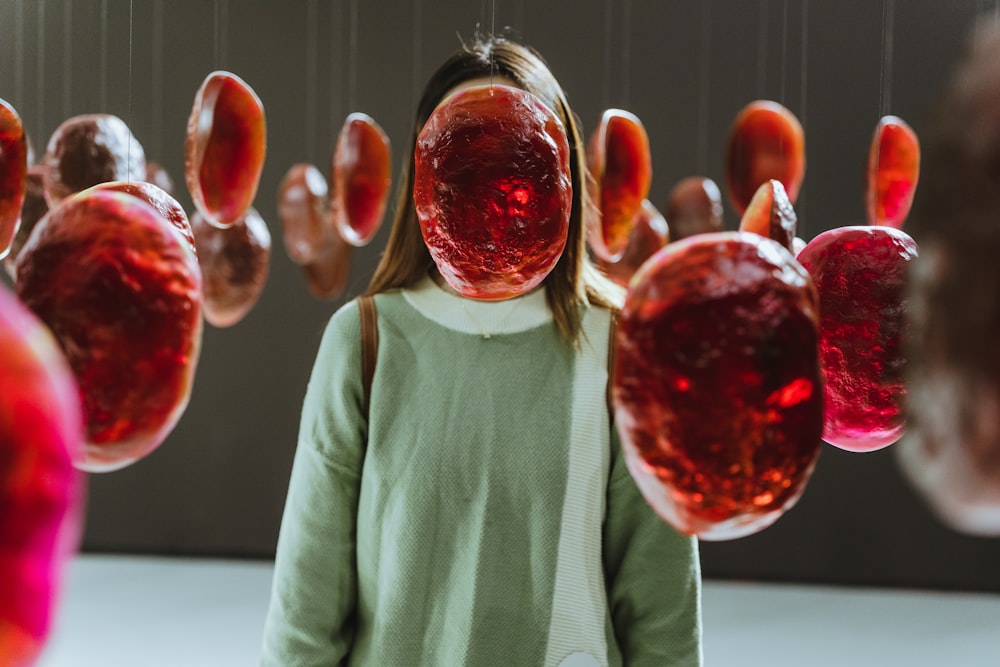 a person holding a bunch of balloons